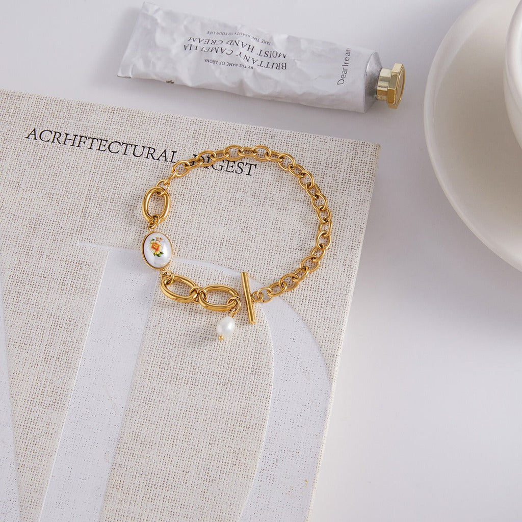 18K gold-plated, lightweight, and luxurious titanium steel bracelet with freshwater pearls. Vera Lux