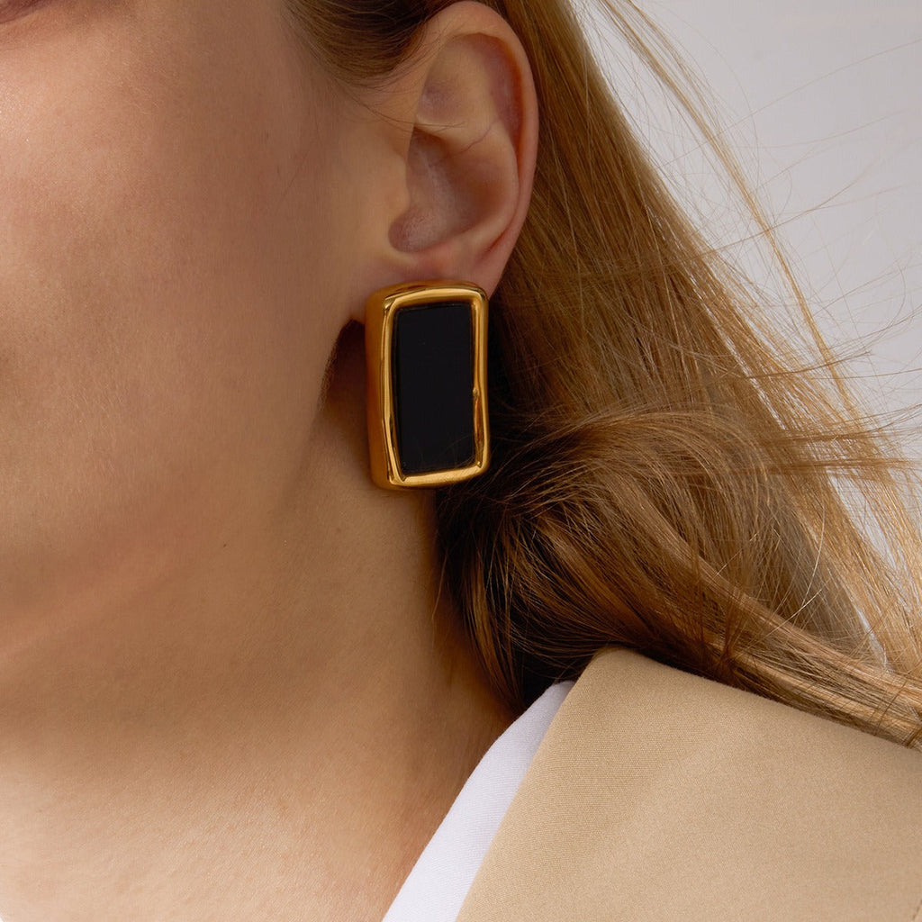 18K gold, black acrylic, and titanium steel stud earrings. Vera Lux