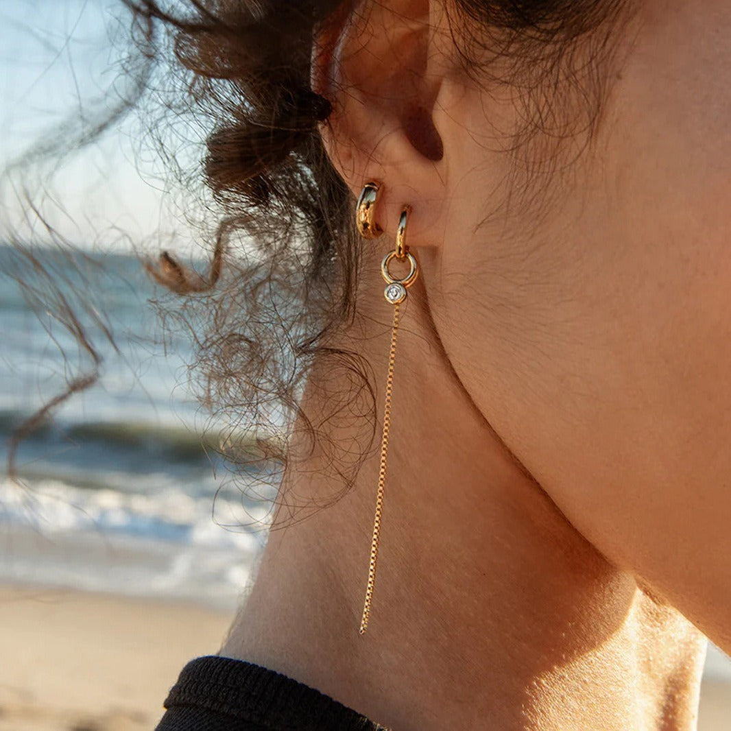 18K gold lightweight luxury tassel earrings with cubic zirconia. Vera Lux