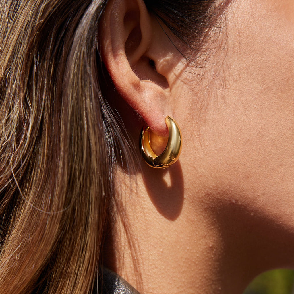 18K gold lightweight luxury earrings with engraved lettering on the inner surface. Vera Lux