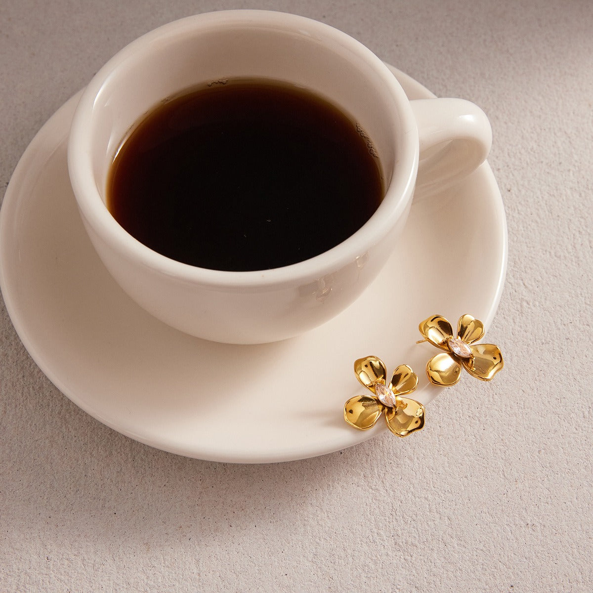 18K gold-plated, luxurious and high-end titanium steel flower-shaped stud earrings with cubic zirconia. Vera Lux