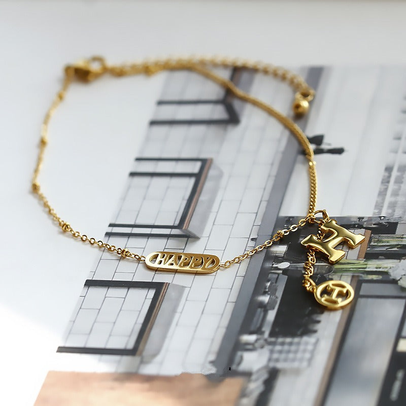 Titanium steel and 18k gold letter H tassel anklet Vera Lux