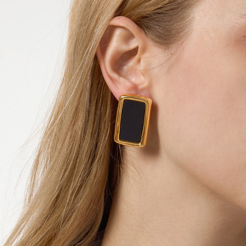 18K gold, black acrylic, and titanium steel stud earrings. Vera Lux