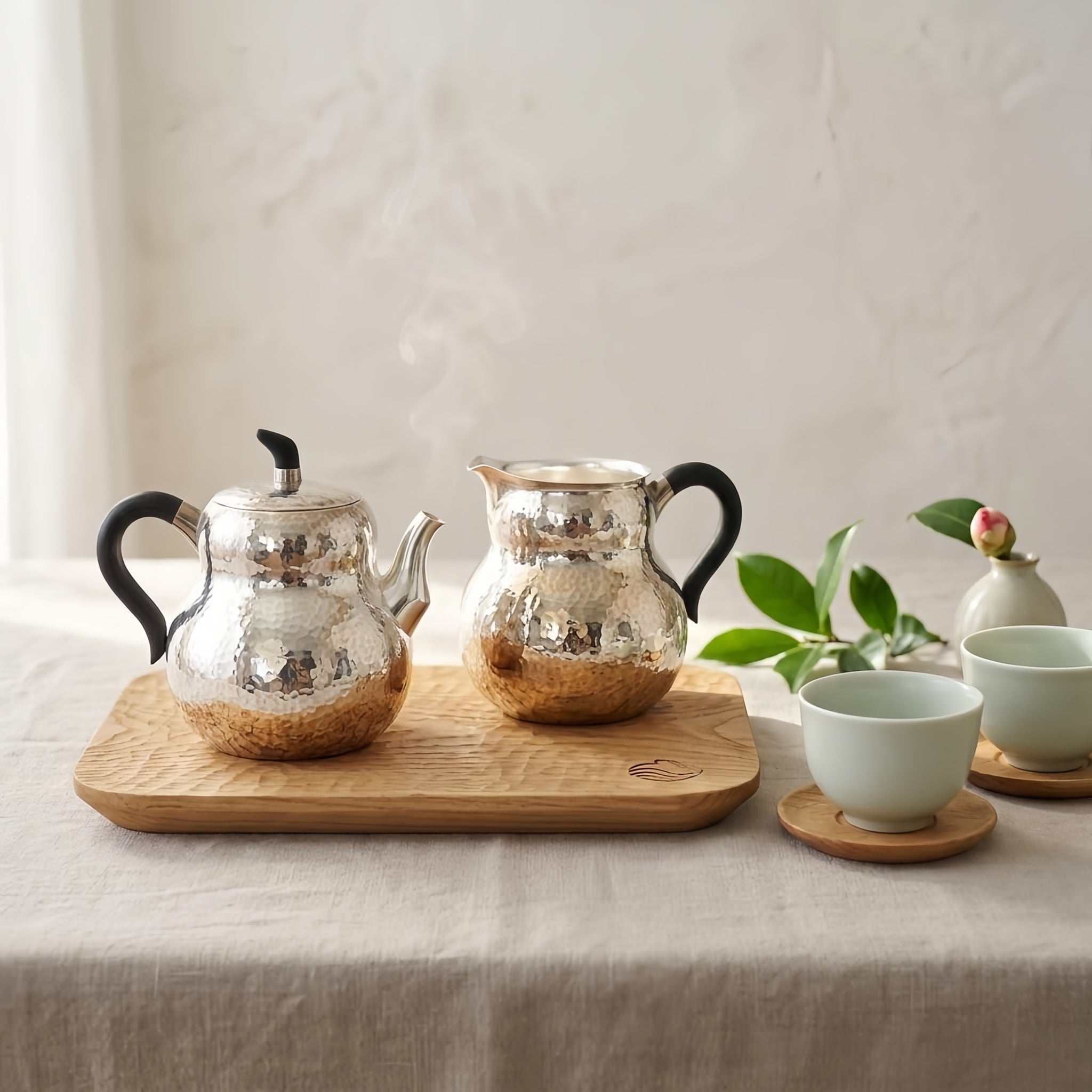 Pure 999 Fine Silver Hand-Hammered Silver Teapot and Creamer Set with Sleek Black Handles and Warm Metallic Accents - Handicraft Vera Lux