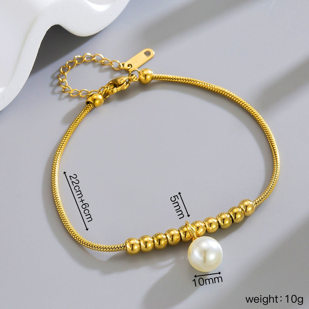18k gold snake bone beaded anklet with a large heart-shaped heart Vera Lux