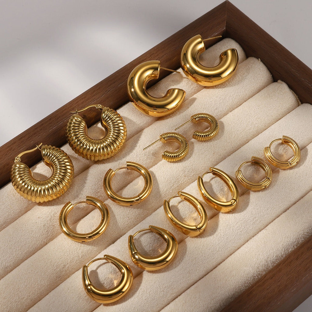 18K gold-plated, lightweight, and luxurious titanium steel stud earrings. Vera Lux