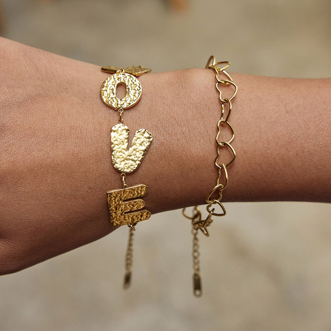18K gold-plated, lightweight, and luxurious titanium steel bracelet with letter design. Vera Lux