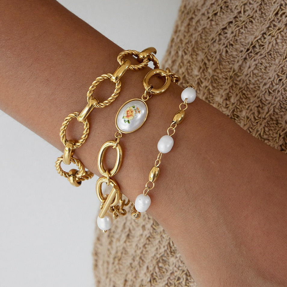 18K gold-plated, lightweight, and luxurious titanium steel bracelet with freshwater pearls. Vera Lux