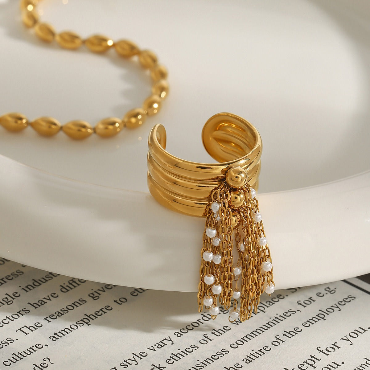 18K gold multi-layered ring with tassel design Vera Lux