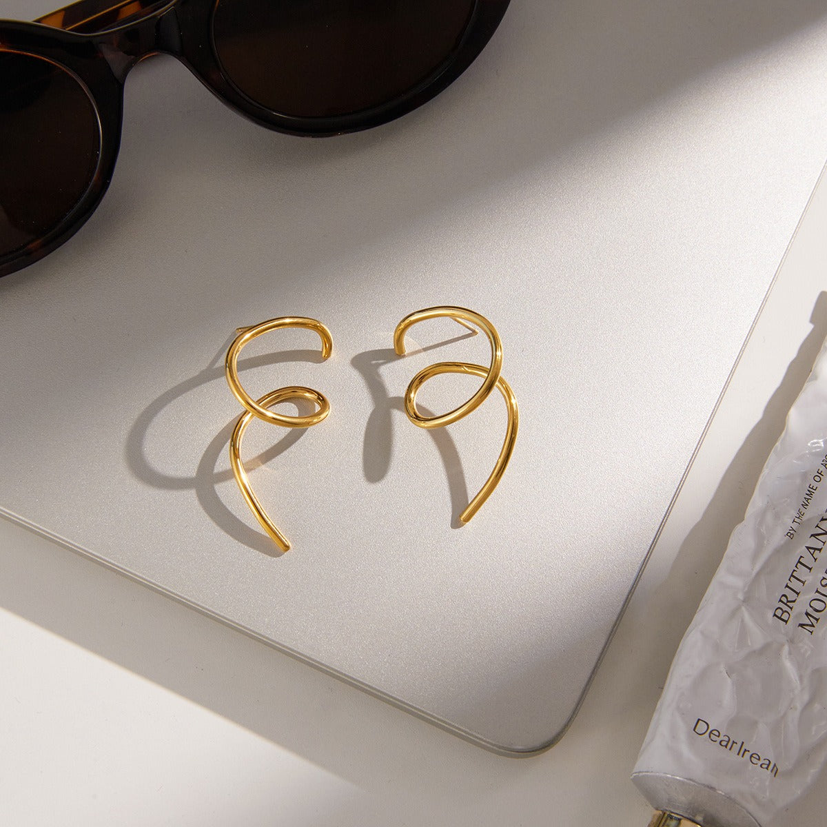 18K gold irregular titanium steel line stud earrings Vera Lux
