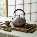Pure 999 Fine Silver Artisanal Hammered Silver Teapot with Woven Rattan Handle and Decorative Finial - Handicraft Vera Lux