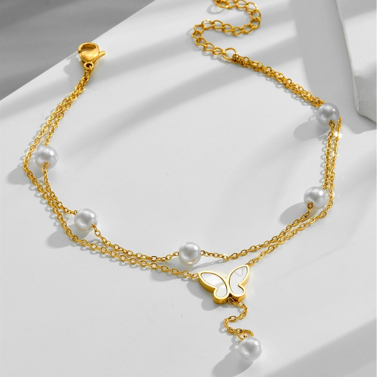 18k gold light luxury multi-layer stacked pearl butterfly tassel anklet Vera Lux