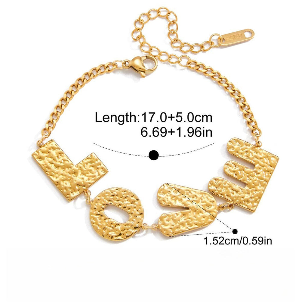 18K gold-plated, lightweight, and luxurious titanium steel bracelet with letter design. Vera Lux