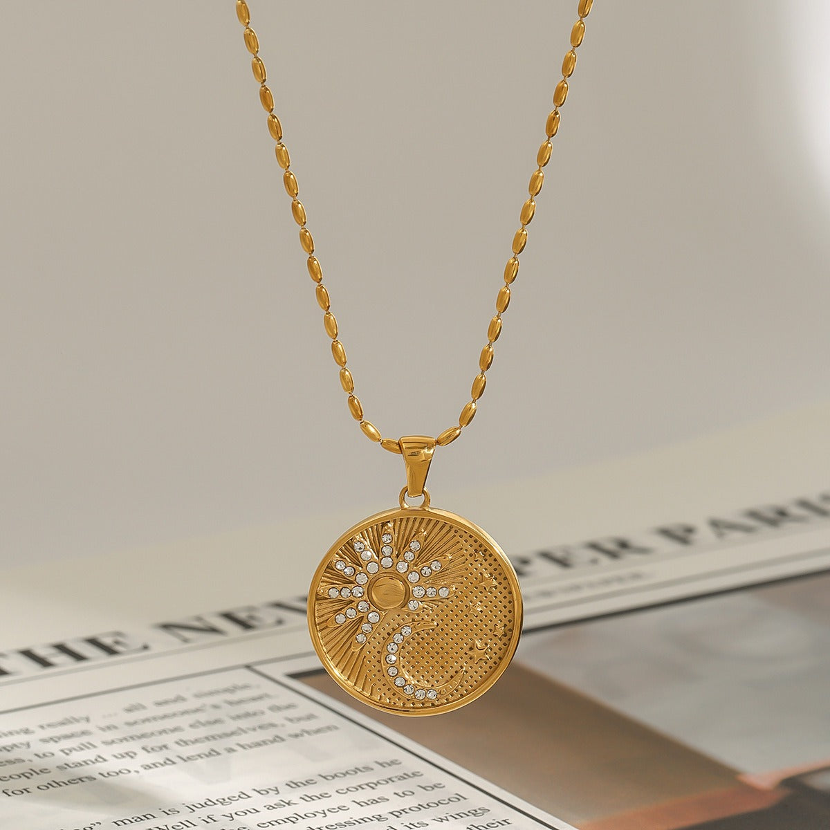 18K gold round necklace with sun and moon pattern and diamond design Vera Lux