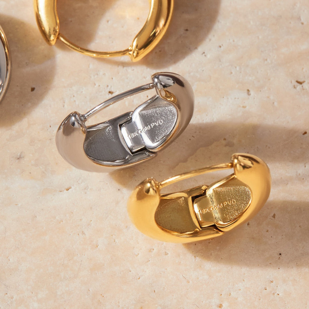 18K gold lightweight luxury earrings with engraved lettering on the inner surface. Vera Lux