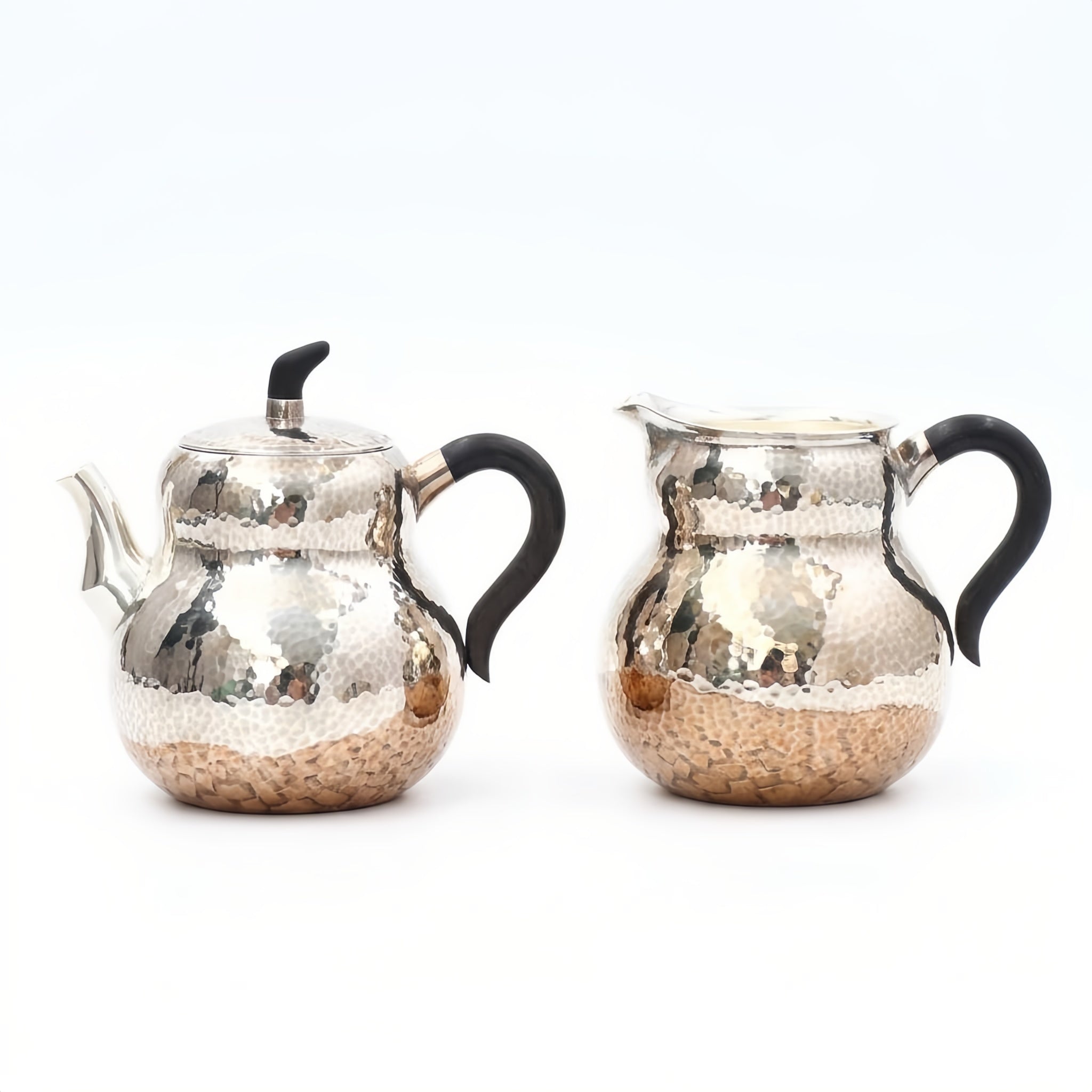 Pure 999 Fine Silver Hand-Hammered Silver Teapot and Creamer Set with Sleek Black Handles and Warm Metallic Accents - Handicraft Vera Lux
