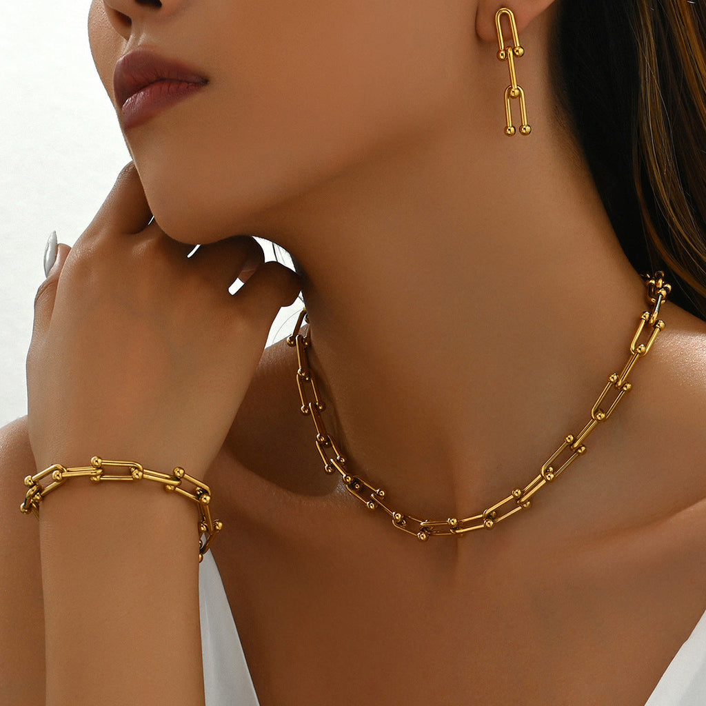 18k gold horseshoe chain bracelet and earrings Vera Lux
