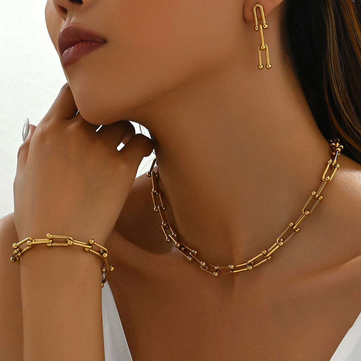 18k gold horseshoe chain bracelet and earrings Vera Lux