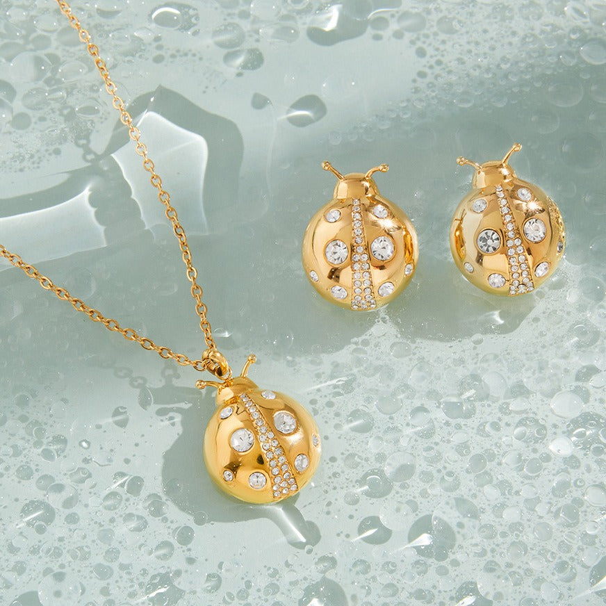 18k gold ladybug titanium steel necklace and earrings Vera Lux