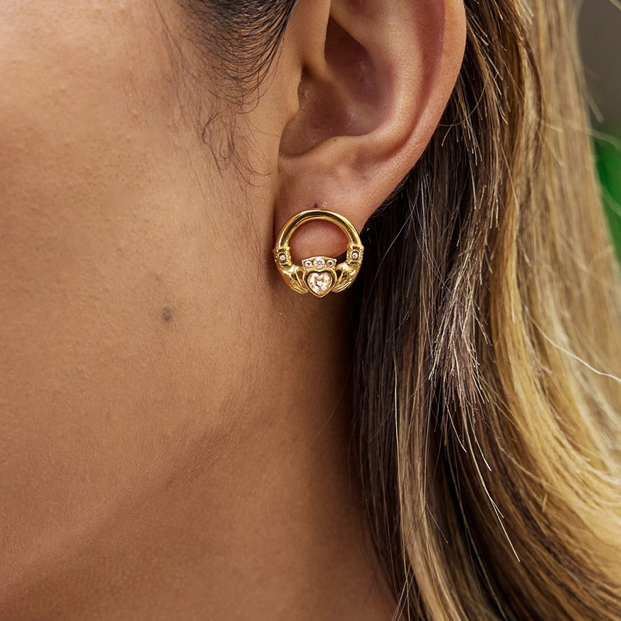 18K gold-plated friendship hand design titanium steel stud earrings with cubic zirconia. Vera Lux