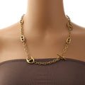 18K gold geometric-shaped necklace, bracelet, and earrings set. Vera Lux