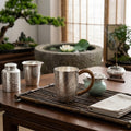 Pure 999 Fine Silver Hammered Silver Mug with Hand-Engraved Lotus Designs and Woven Handle - Handicraft Vera Lux