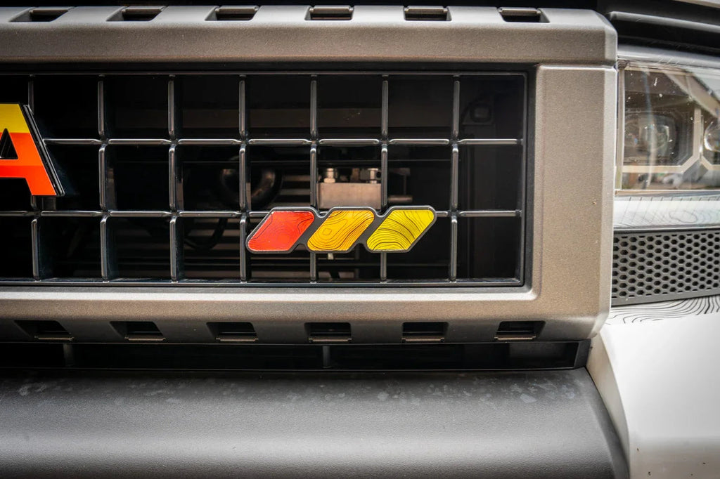 Tri Color Topographic Grille Emblem - 2024+ Land Cruiser / 2016-2013 Tacoma StickerFab