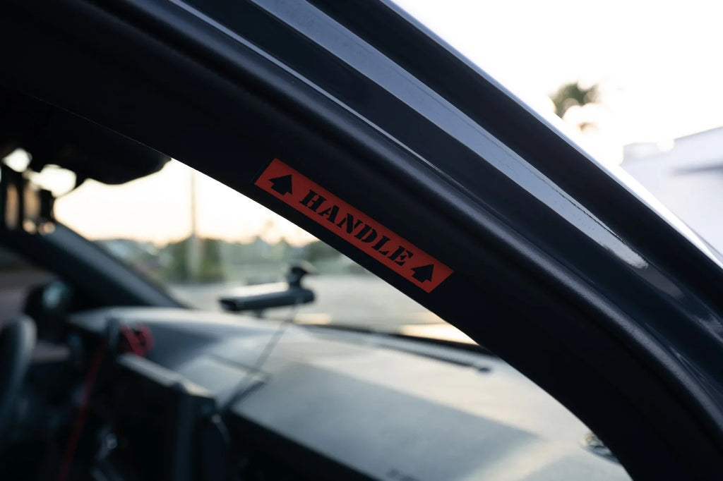 Passenger Side Grab Handle Warning Label - 2024+ Tacoma / 2025+ 4Runner StickerFab
