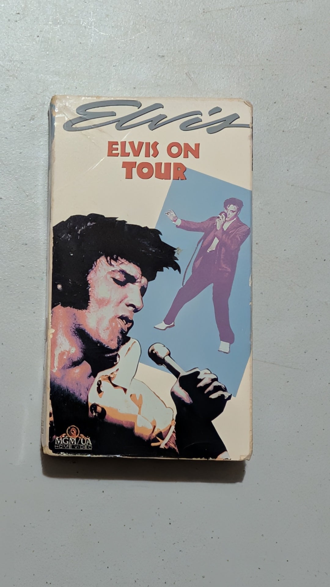 Elvis on Tour from MGM/UA Home Video - 1980s Media (VHS Cassette, Cardboard VHS Tape, Film Memorabilia, Retro, Cream, Red, Purple, Collectable, Vintage, Original) Merritt Island Curios