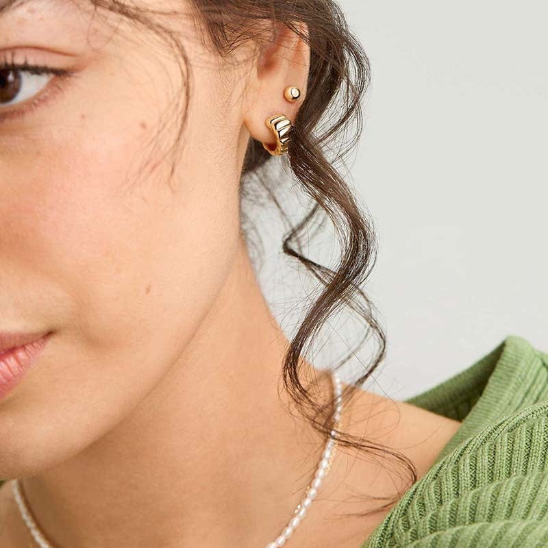 18K gold-plated, solid sterling silver C-shaped hoop earrings. Vera Lux