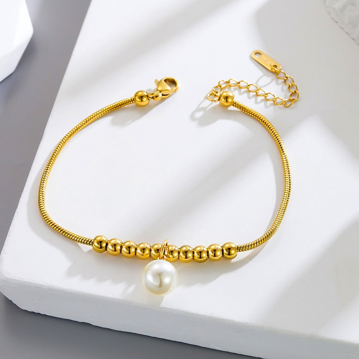 18k gold snake bone beaded anklet with a large heart-shaped heart Vera Lux