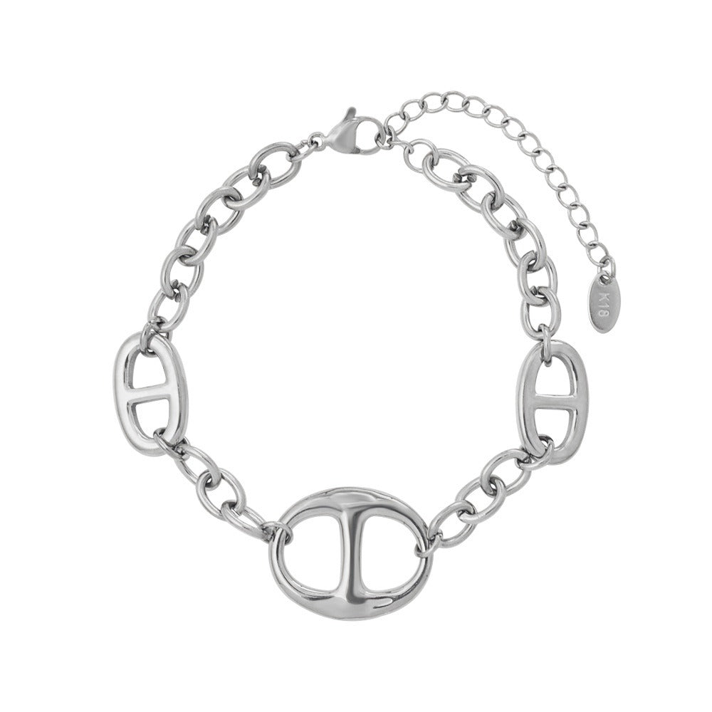 18K gold geometric-shaped necklace, bracelet, and earrings set. Vera Lux