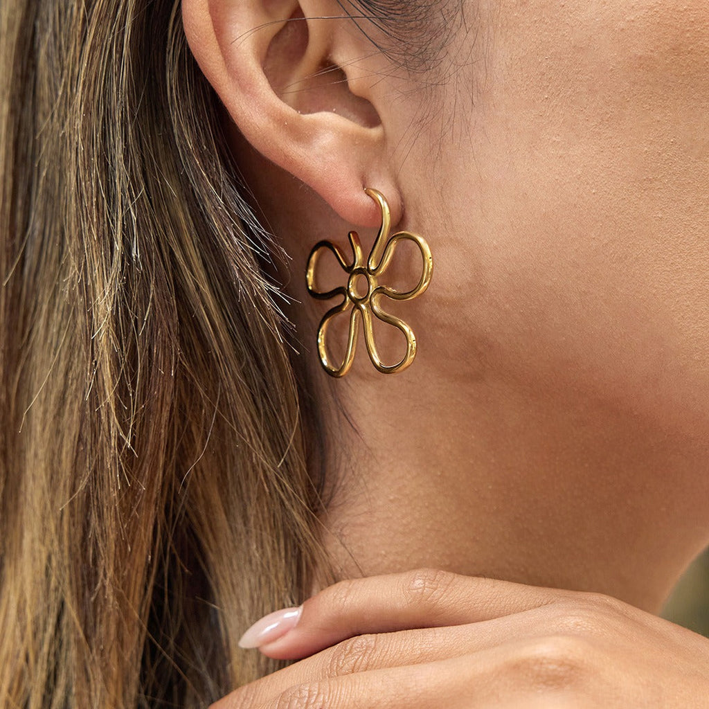 18K gold-plated, lightweight, and luxurious flower-shaped titanium steel earrings. Vera Lux