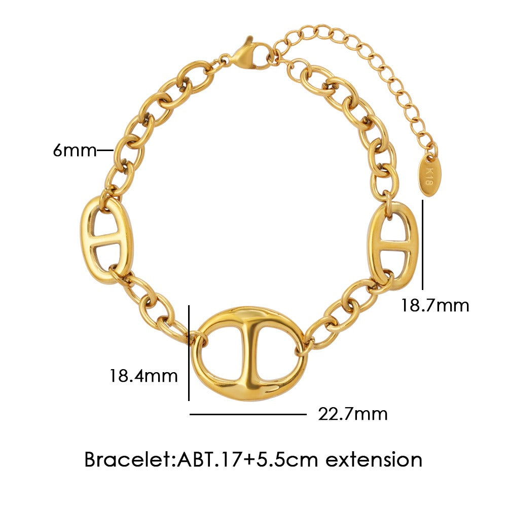 18K gold geometric-shaped necklace, bracelet, and earrings set. Vera Lux
