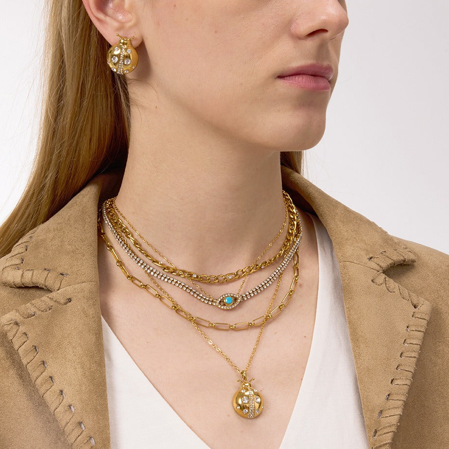 18k gold ladybug titanium steel necklace and earrings Vera Lux