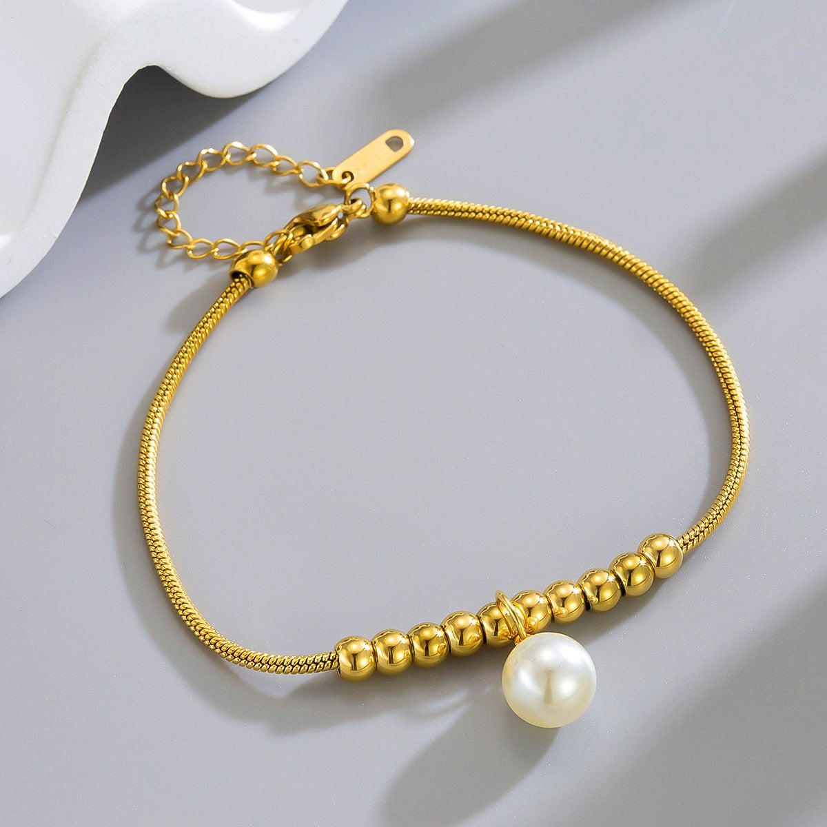 18k gold snake bone beaded anklet with a large heart-shaped heart Vera Lux
