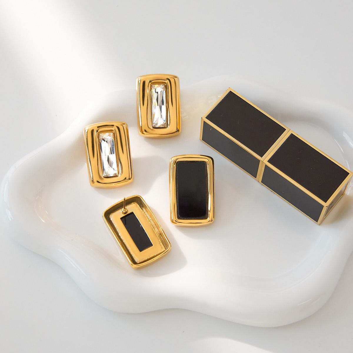 Square 18K gold-plated titanium steel stud earrings with embedded cubic zirconia. Vera Lux