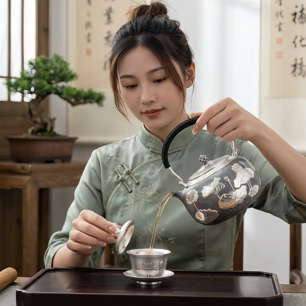 925 Sterling Silver Artisan Crafted Silver Teapot Featuring Embossed Lotus Pond Motif and Black Cord Handle - Handicraft Vera Lux