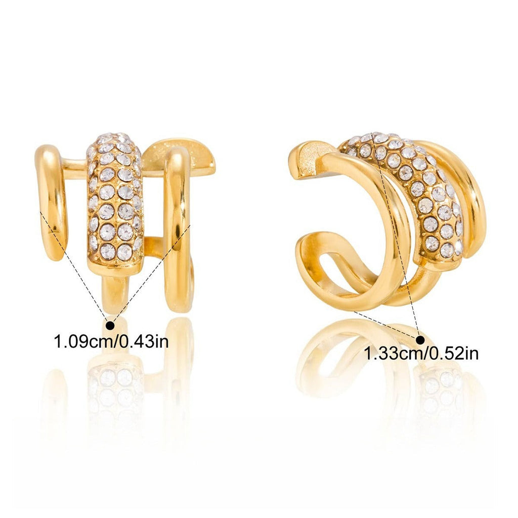 18K gold earrings inlaid with cubic zirconia, in a nail design. Vera Lux