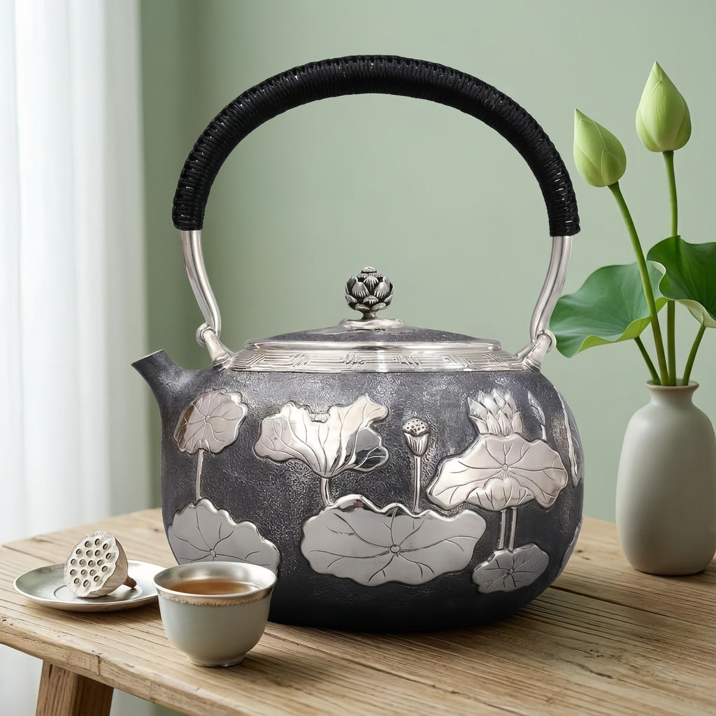 925 Sterling Silver Artisan Crafted Silver Teapot Featuring Embossed Lotus Pond Motif and Black Cord Handle - Handicraft Vera Lux