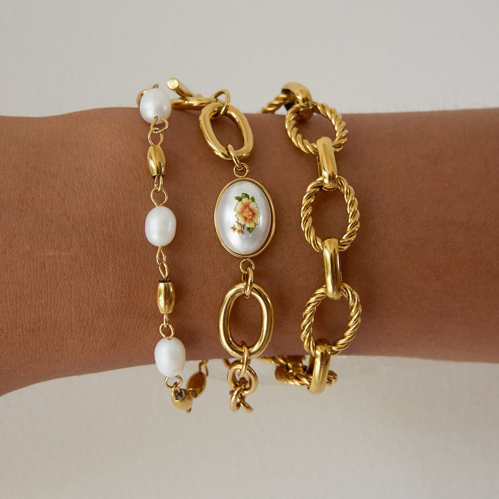 18K gold-plated, lightweight, and luxurious titanium steel bracelet with freshwater pearls. Vera Lux