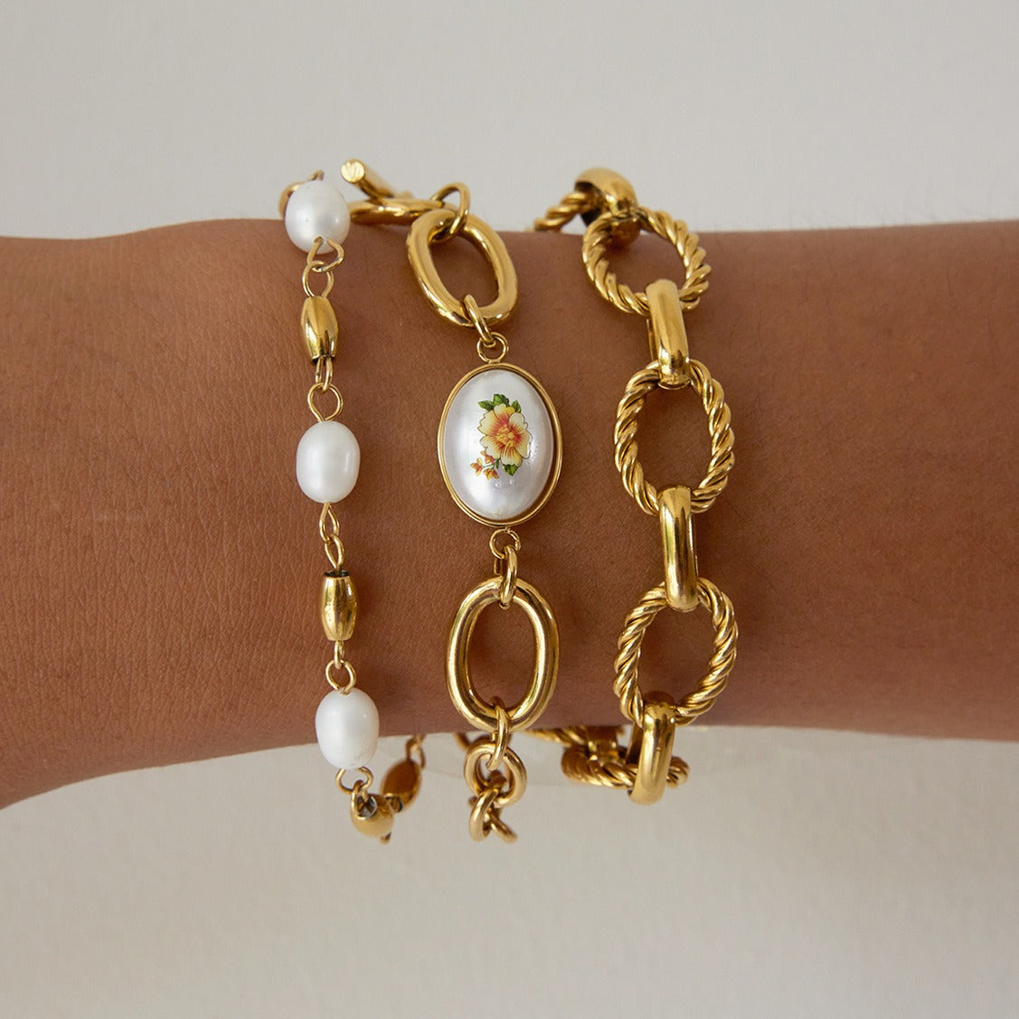 18K gold-plated, lightweight, and luxurious titanium steel bracelet with freshwater pearls. Vera Lux