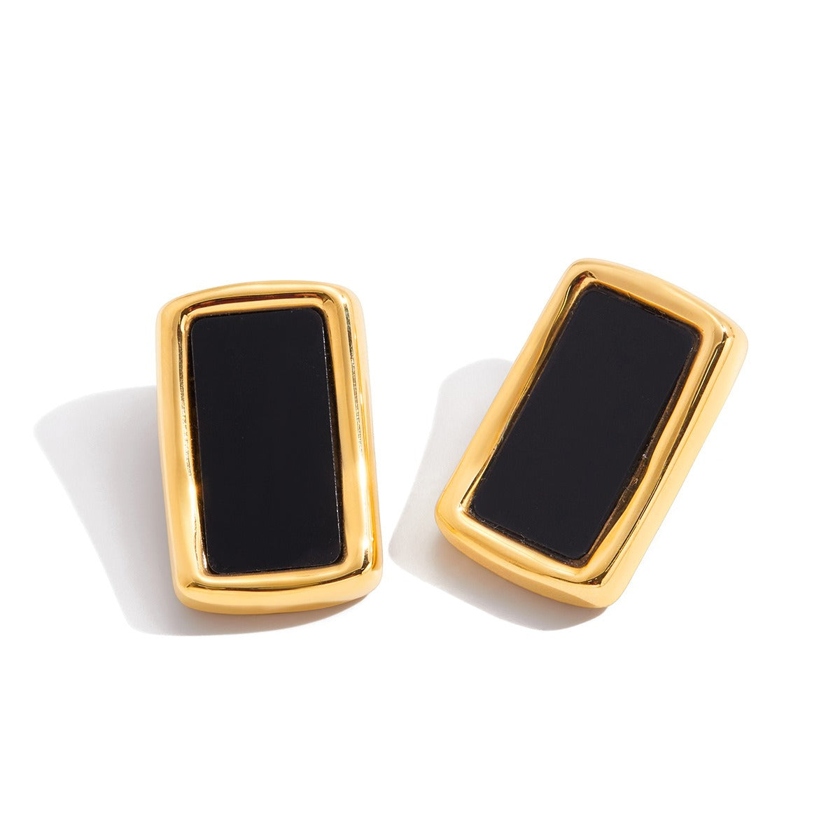18K gold, black acrylic, and titanium steel stud earrings. Vera Lux