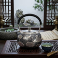925 Sterling Silver Artisan Crafted Silver Teapot Featuring Embossed Lotus Pond Motif and Black Cord Handle - Handicraft Vera Lux