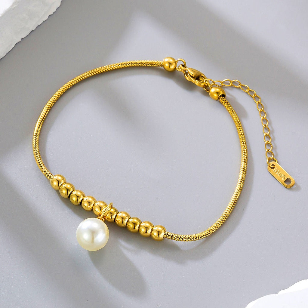 18k gold snake bone beaded anklet with a large heart-shaped heart Vera Lux