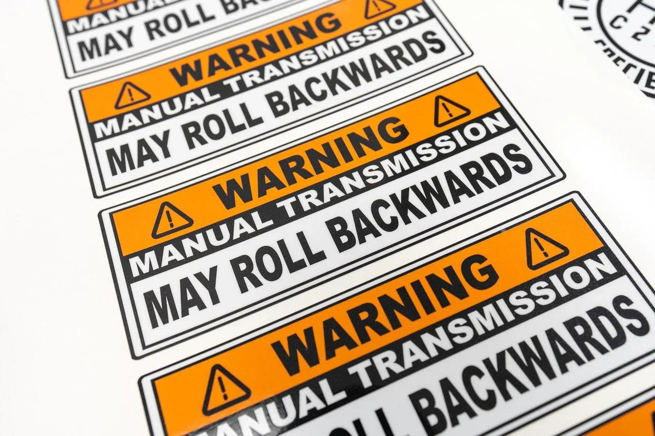 Manual Transmission May Roll Back Warning Sticker 6.5"  - Universal StickerFab