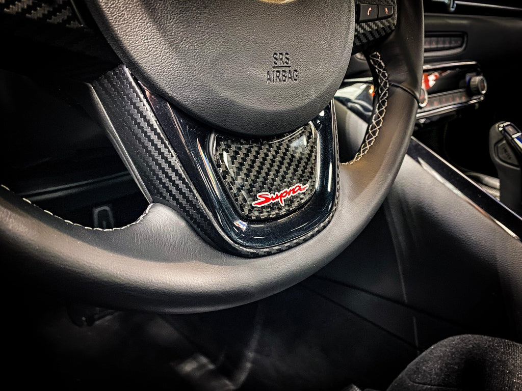 Real Carbon "Supra" Steering Wheel Trim Overlay (Lower) - 2020+ Supra StickerFab