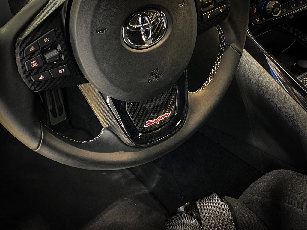 Real Carbon "Supra" Steering Wheel Trim Overlay (Lower) - 2020+ Supra StickerFab