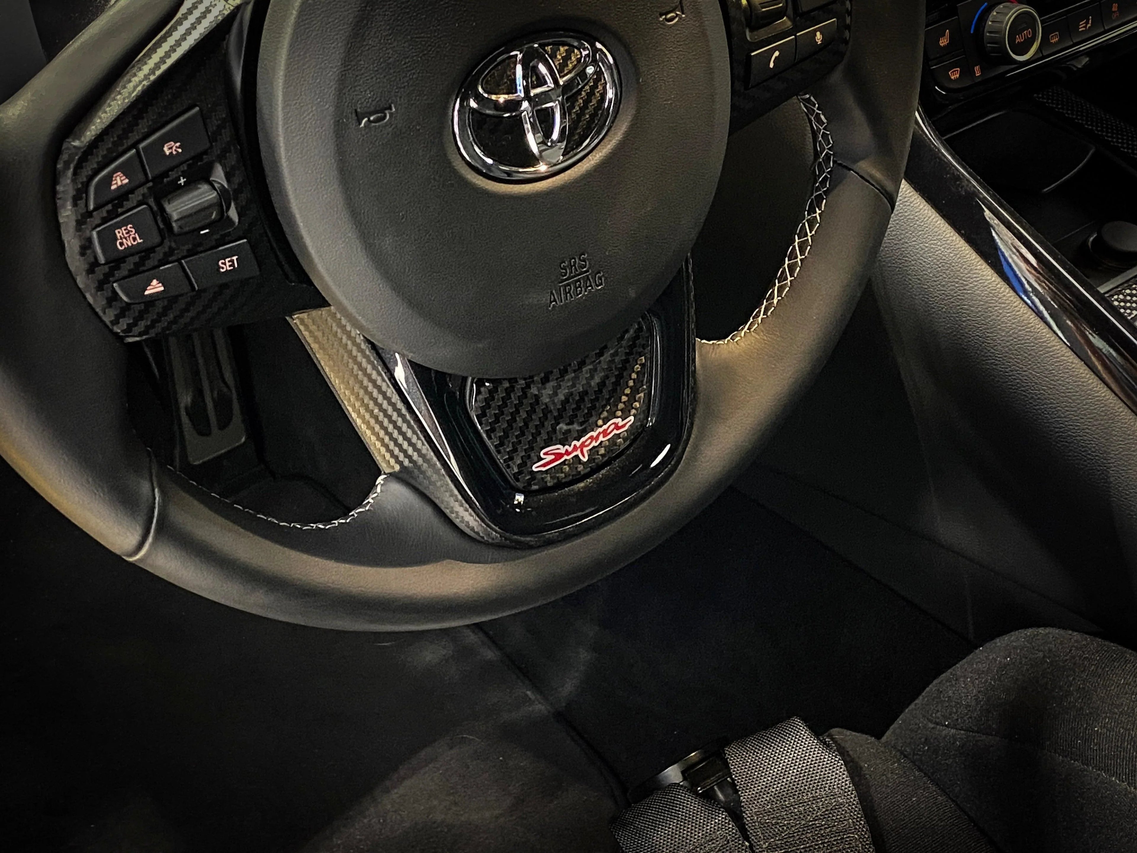 Real Carbon "Supra" Steering Wheel Trim Overlay (Lower) - 2020+ Supra StickerFab